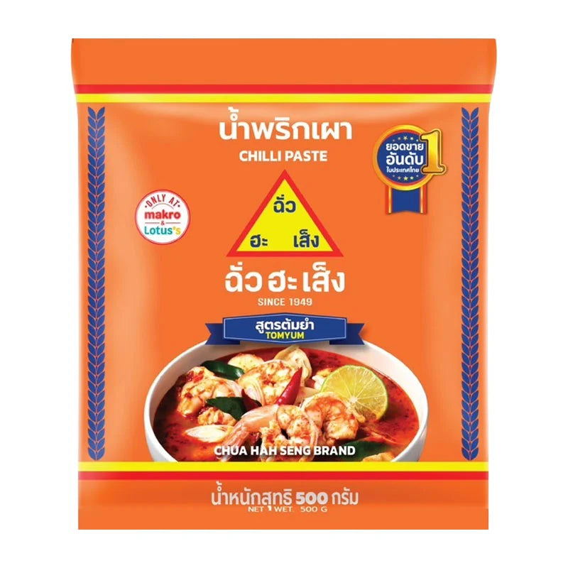 Chua Hah Seng Tomyum Chilli Paste 500g jar with red chili and herbal ingredients visible, ready for cooking or seasoning.