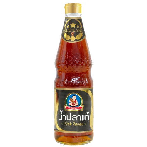 Bottle of DEKSOMBOON Fish Sauce Gold Label 700ml, clear glass bottle with golden label and dark fish sauce inside