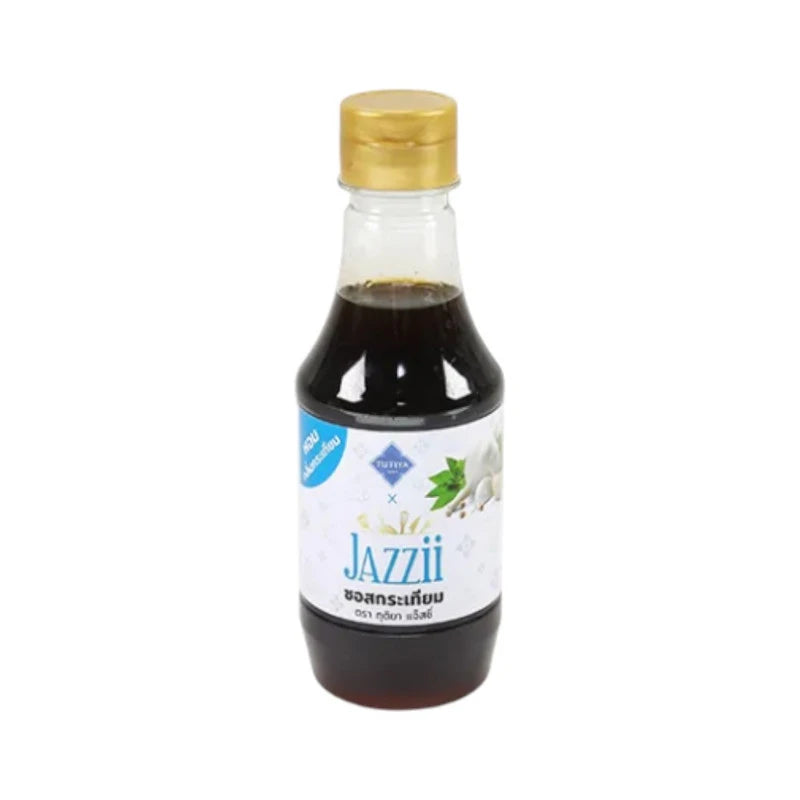 Tutiya Picante Jazzy Garlic Sauce bottle with label, showcasing spicy garlic sauce in a clear glass container.