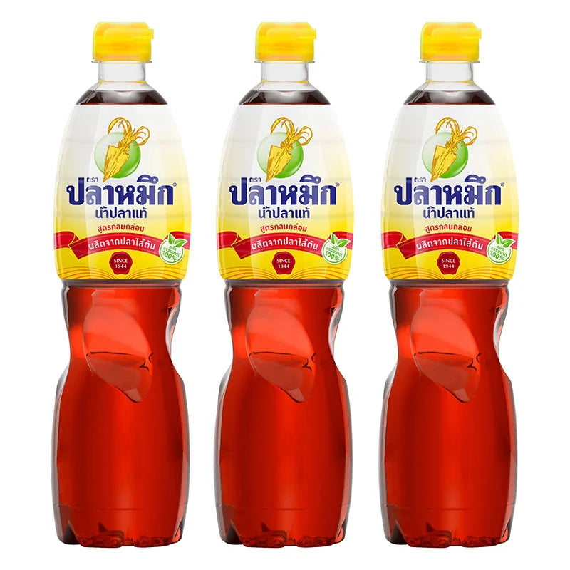 SQUID BRAND Yellow Fish Sauce 700ml bottle, close-up of the 3-pack with labels and transparent bottles showing the golden liquid inside.
