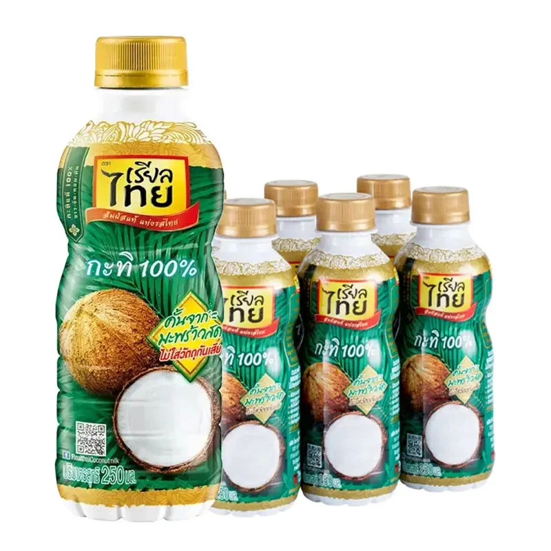 Real Thai coconut milk PET bottle, 250 ml, packed in a set of six, showcasing the creamy white coconut milk inside.