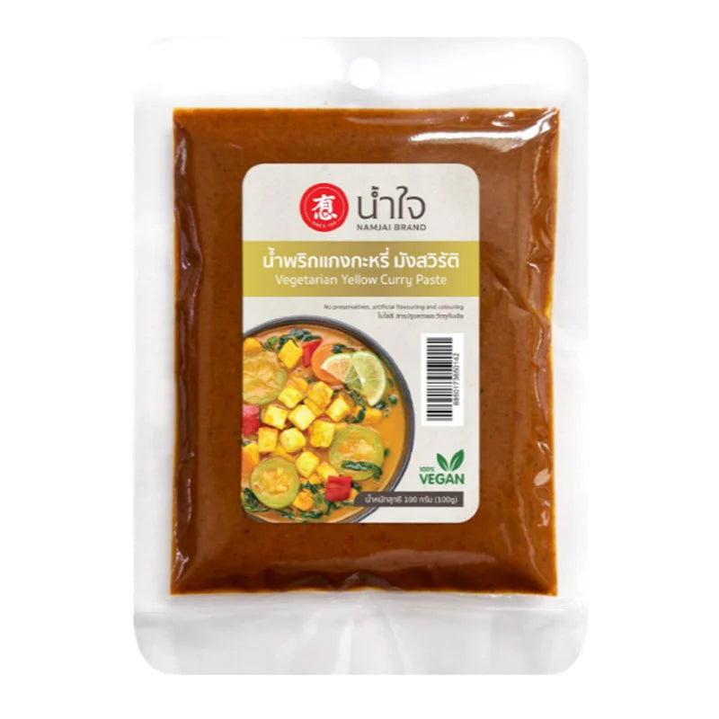 Yellow curry paste by NAMJAI in a 100g jar, showing the vibrant yellow-colored paste with Thai herbs and spices.