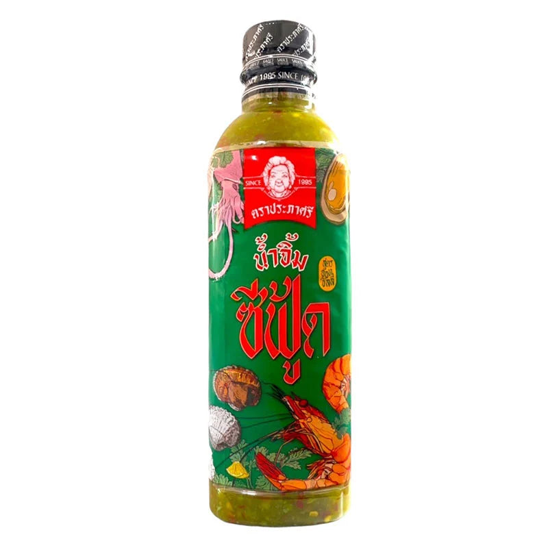 PRAPASRI Seafood Sauce 500g jar with a smooth, dark sauce inside, placed on a white surface with a blurred background.
