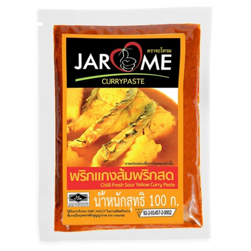 Makro Yellow Curry Paste 100g, showing vibrant yellow Thai curry paste in a jar with fresh herbs and spices.