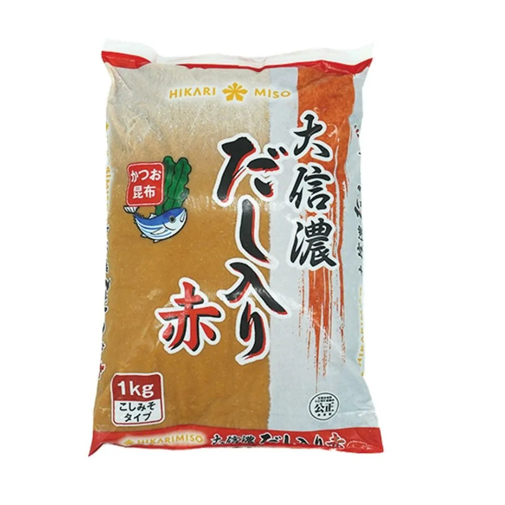 Frozen 1kg DAISHINANO SHIRO Aka Miso paste in a clear container, showcasing its rich, reddish-brown color and smooth texture.