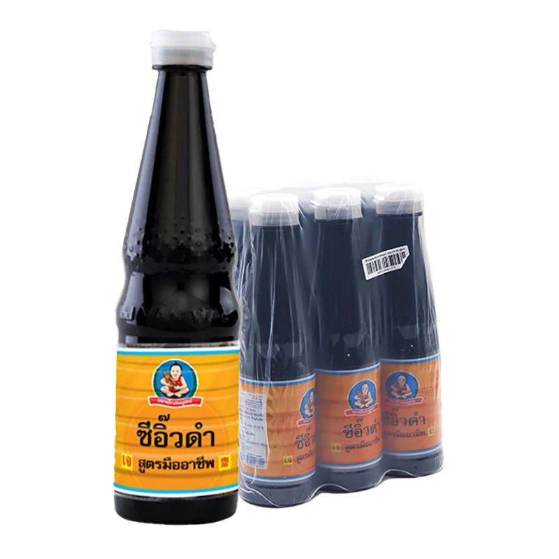 Six bottles of DEK SOM BOON Black Soy Sauce, 370 ml each, displayed in a row with dark soy sauce visible inside the bottles.