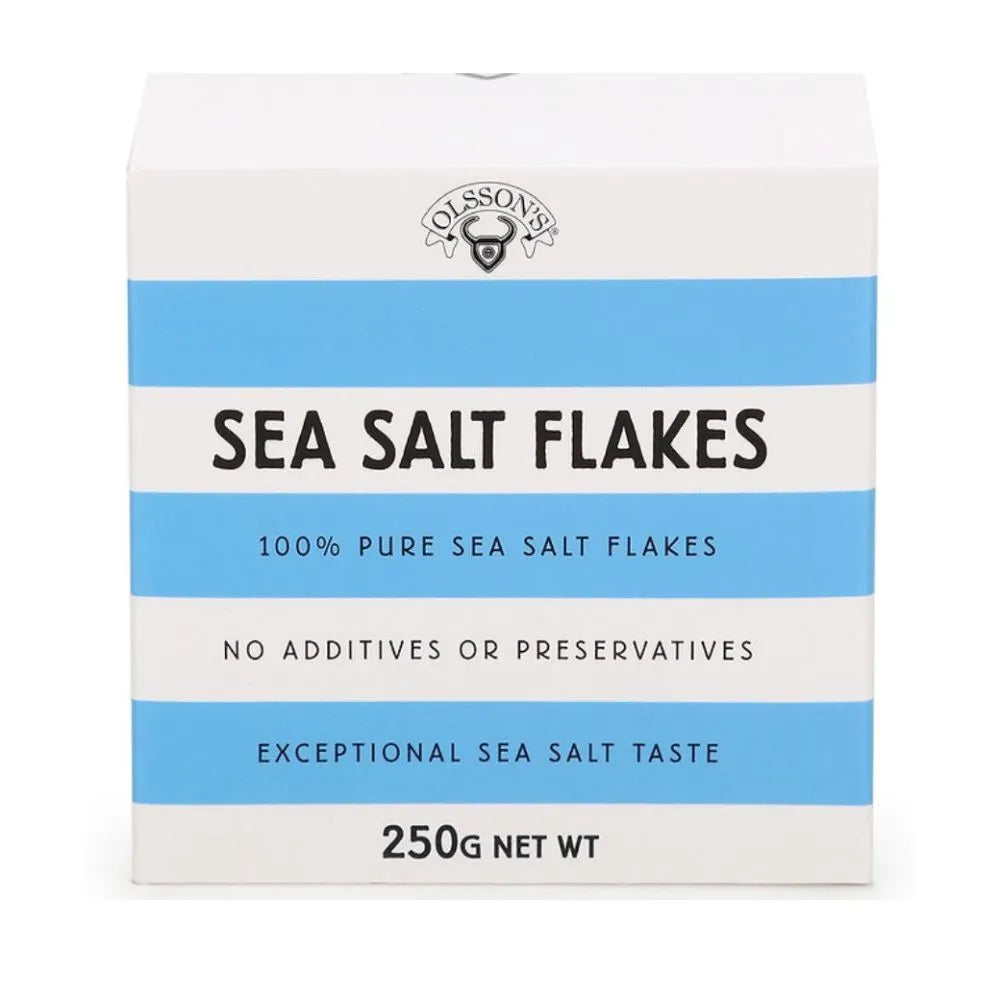 OLSSON Sea Salt Flakes Cube 250G, close-up of flaky sea salt in a clear cube-shaped container, highlighting its texture and natural appearance.