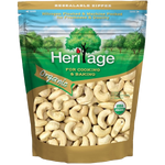 Heritage Organic Whole Cashew Nuts in a clear bowl, showcasing their creamy, natural color and crunchy texture for healthy snacking.