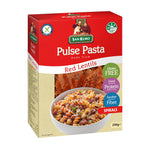 San Remo Red Lentils Spirals in a clear bowl, showcasing the bright red, spiral-shaped pasta on a white background.