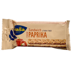 Wasa Sandwich Cheese & Paprika confectionery snacks with crispy layers and cheese filling, topped with paprika on a white background