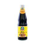 Deksomboon Black Soy Sauce 940g bottle, premium dry grocery product with dark liquid soy sauce for cooking and seasoning.