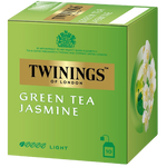 A cup of brewed Twining's Jasmine Green Tea in a glass mug with tea leaves and jasmine flowers beside it.