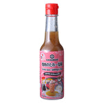 Kikkoman Yakiniku Sauce with salt and pepper flavor, bottle of savory Japanese barbecue sauce for grilling and dipping.