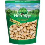 Heritage Macadamia Nuts in confectionery snack packaging, showing whole roasted macadamia nuts and branding label.