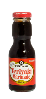 Bottle of Kikkoman Teriyaki Sauce in a grocery setting, showcasing the label and sauce inside the clear bottle.