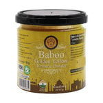 Golden yellow Baboo Turmeric Powder in a clear container, showcasing vibrant powdered spice for cooking and health benefits.