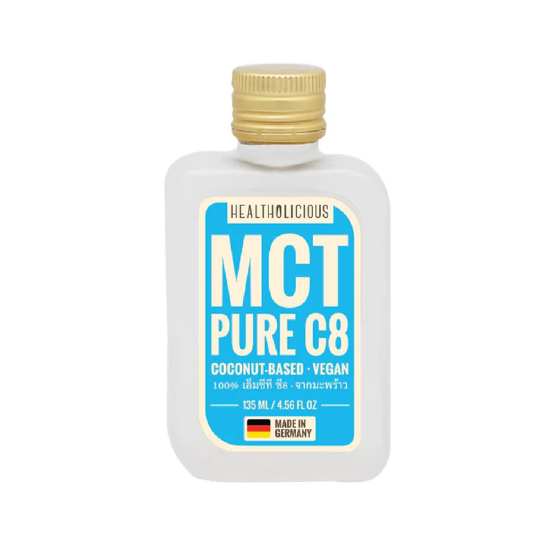 Healthy coconut MCT oil bottle from Healtholicious, featuring clear label and golden liquid inside a glass container.