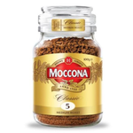 A cup of Moccona Classic Medium Roast coffee in a white mug on a wooden table, showcasing a rich, dark brew.