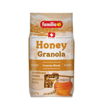 Familia Honey Granola in a clear bowl, showing golden, crunchy oats and honey clusters, perfect for breakfast or snacking.