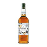Giffard Barista Macadamia Nuts 1L bottle, dry grocery product with whole macadamia nuts in clear packaging.