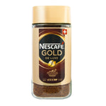 A steaming cup of Nescafe Gold Deluxe coffee in a white mug, showcasing its rich, aromatic coffee drink.