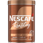 Nescafe Gold Blend Roastery Light Roast Coffee drink in a clear glass cup with coffee beans in the background.
