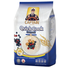 Captain Quick Cooking Oatmeal in a bowl, ready to serve, with a spoon and a cozy breakfast setting.