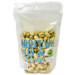 Heritage roasted salted pistachios in a clear bowl, showcasing crunchy, salted green nuts perfect for snacking.