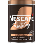 Nescafe Gold Blend Roastery Collection Dark Roast coffee drink in a glass mug with brewed coffee and a spoon.