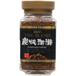 Ucc Sumiyaki Coffee drink in a clear glass, showcasing dark roasted coffee with a rich, smoky appearance.