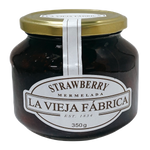 Jar of Fragata Strawberry Preserves showing fresh strawberries and jam inside a glass jar.