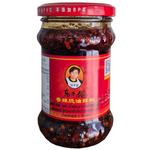 Laoganma Crispy Chilli Paste jar with red chili paste and crispy bits, typical packaging for Laoganma grocery condiment.