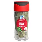 Fresh dried McCormick Bay Leaves in a glass jar, ready for culinary use in soups, stews, and recipes