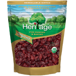 Heritage Organic Dried Cranberries in a clear bowl, showcasing vibrant red, chewy, natural confectionery snack.