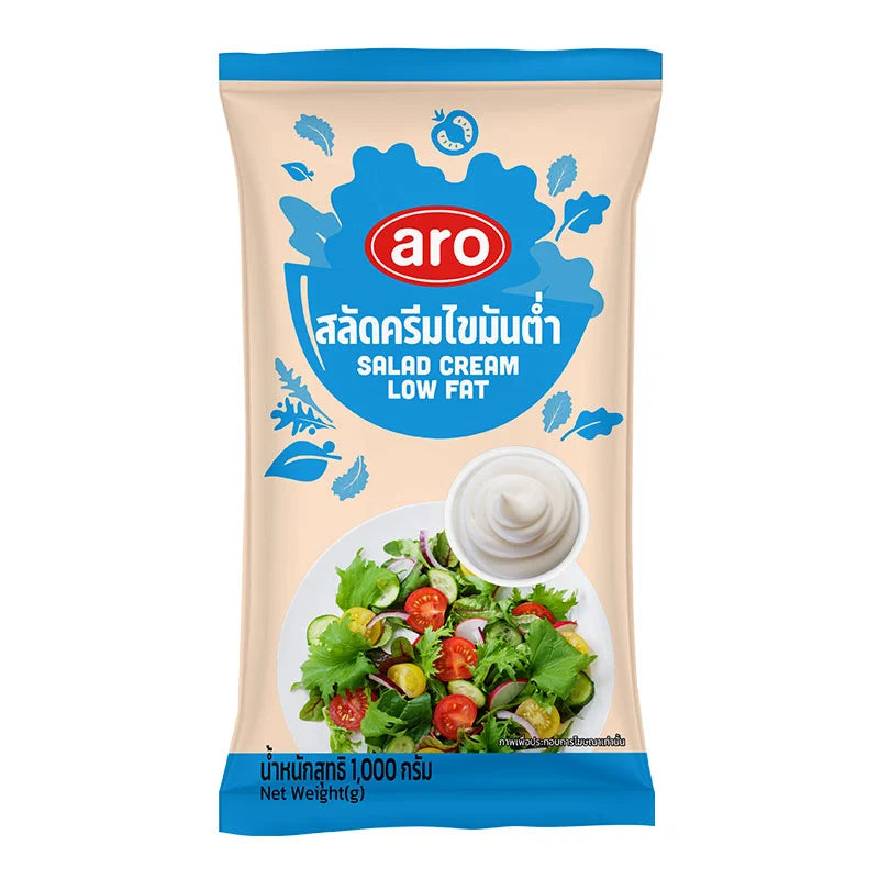 Jar of ARO Low Fat Salad Cream 1 kg with creamy white texture, ideal for salads and dressings.