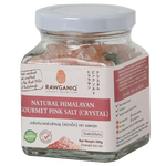 Rawganiq Himalayan Pink Salt Crystals in a clear jar, showcasing pink mineral-rich salt crystals for culinary use.