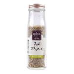 Dried thyme spice from Spice Story in a clear glass jar, ready for culinary use.