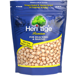 Heritage Raw Chick Beans in a bowl, showcasing their beige color and smooth texture, ideal for cooking or recipes.