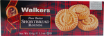 Walkers Butter Shortbread Rounds, golden-brown buttery confectionery snacks with crispy, round shortbread biscuits on a white plate.