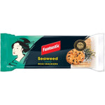 Golden rice crackers with seaweed flavor from Fantastic, showcasing crispy, healthy confectionery snacks in a close-up view.