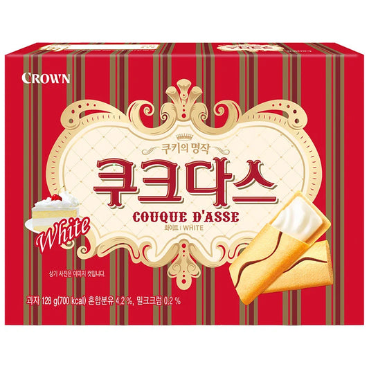 CROWN Couque D'Asse White Torte 128g, showing a rich, creamy white layered cake with intricate decorative topping.