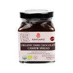 Rawganiq organic dark chocolate cashew spread in a jar, creamy texture, and rich chocolate and nut flavor, grocery product.