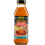 Lobo Moo Krata dipping sauce in a jar, featuring a rich, dark Thai-style sauce with herbs and spices, for dipping or cooking.