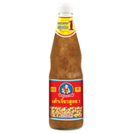Healthy Boy Soya Sauce bottle, a popular grocery item, with dark soy sauce inside, displayed on a kitchen shelf.