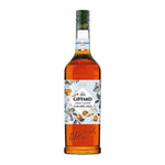 Giffard Barista Caramel 1L bottle of caramel syrup for coffee and beverages, in clear plastic bottle with label.
