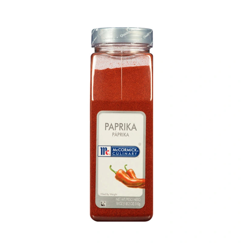 McCormick paprika spice jar, 510 g, with vibrant red powdered paprika in a clear container.