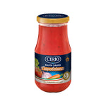 Jar of Cirio Pasta Sauce Napoletana with fresh herbs and tomatoes, showing the vibrant, red tomato-based sauce inside.