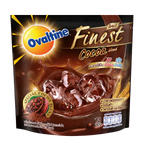 Ovaltine Finest Cocoa drink mix in a jar with a spoon, showing the chocolate powder for hot or cold beverages.
