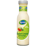 Remia Salad Cream bottle with white label and green cap, displayed on a grocery store shelf.