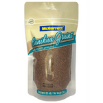 McGarrett Canihua grains in a clear container, showcasing small beige Canihua seeds, fresh and ready for cooking.